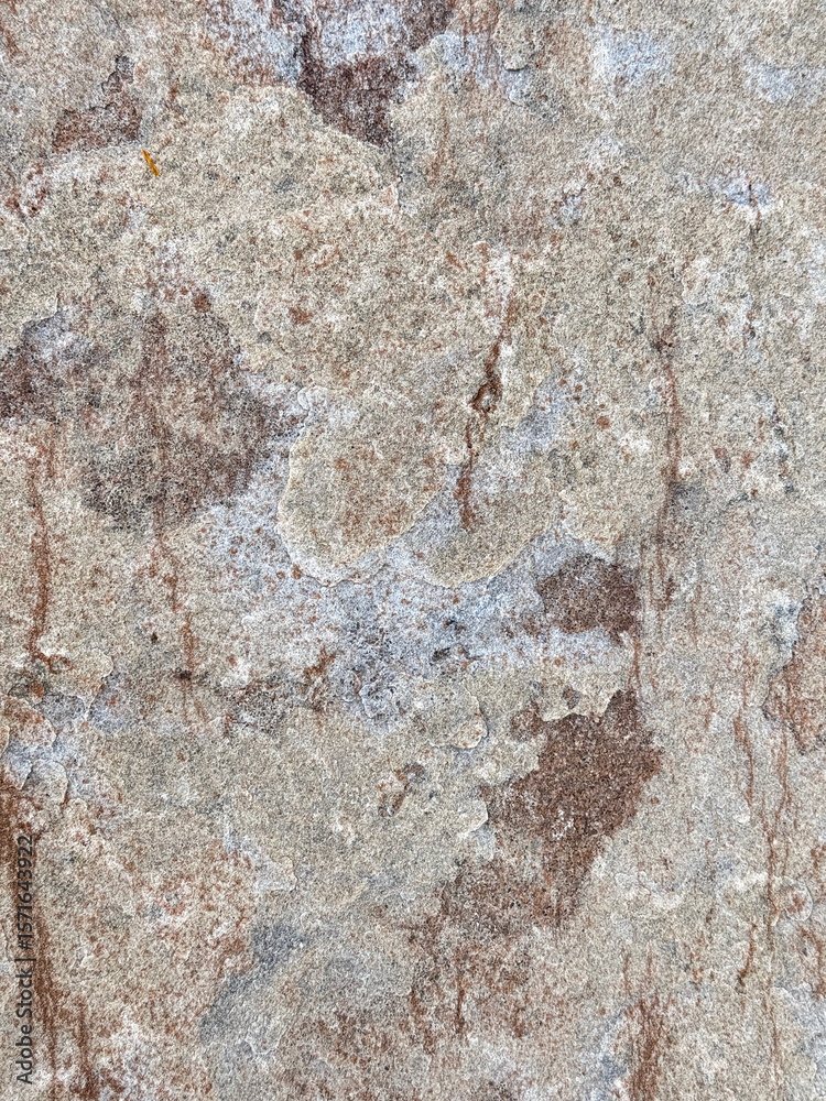 Naklejka premium Weathered Stone Surface with Earthy Red and Gray Tones