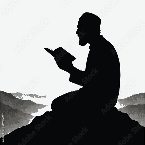 Silhouette of a muslim man reading a book on a mountain at sunrise
