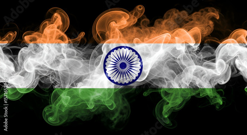 Artistic abstract representation of Indian national tricolor flag using swirling smoke texture with Ashoka chakra on black background symbolizing independence and patriotic spirit