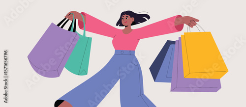 Happy woman with many shopping bags enjoying a day of retail therapy