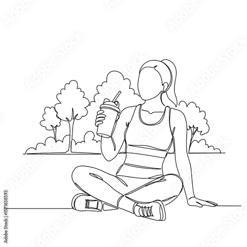 Woman sitting in park and drinking protein drink in summer  