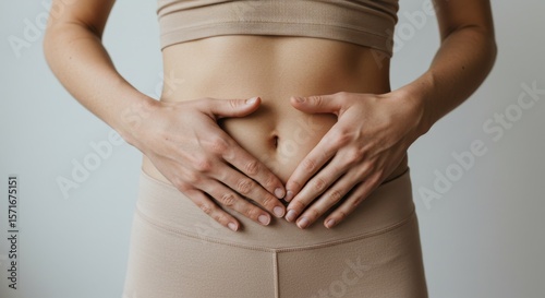 Wallpaper Mural Close-up of a person's hands gently resting on their bare stomach,  Torontodigital.ca