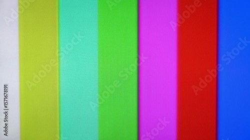 A vintage television screen displays colorful test pattern bars