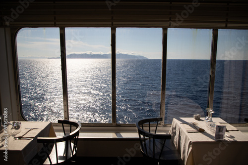 Fototapeta Naklejka Na Ścianę i Meble -  restaurant table and the sea in the background