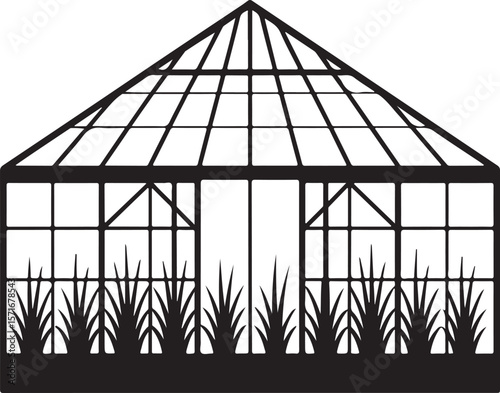 Classic greenhouse structure with glass panes and grass silhouette