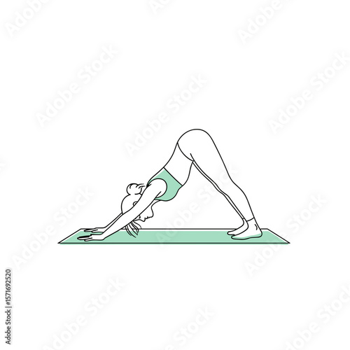 Woman performing downward dog yoga pose on exercise mat  