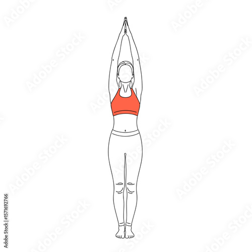 Young woman performing yoga pose with hands raised indoors  