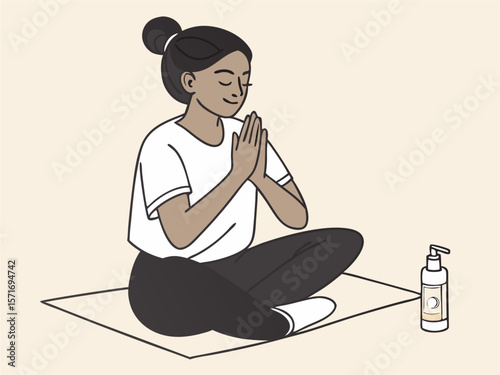 Serene female practicing mindfulness sitting cross-legged with hands clasped in quiet minimalist setting