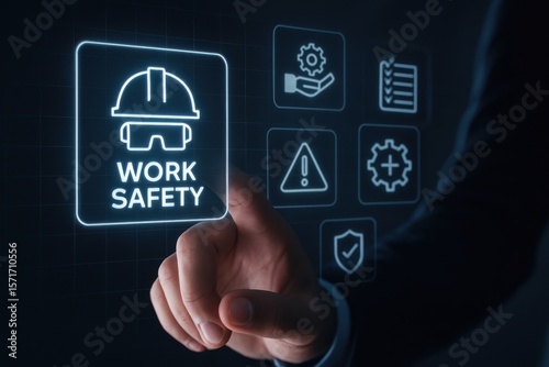 Man touching digital screen with work safety icons and protective gear symbol