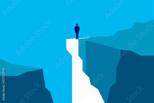 Man Standing On Cliff Rock Looking Down