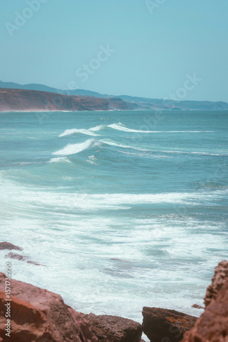 Rocky Shoreline with ocean waves rolling in portugal