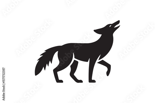 Silhouetted Coyote, Looking Upwards, Perfect for Wilderness Themes.A bold, stylized silhouette of a coyote, presented in profile view with its head tilted upwards.