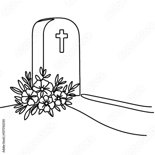 Grave mound with flowers beside a cross on a hillside  