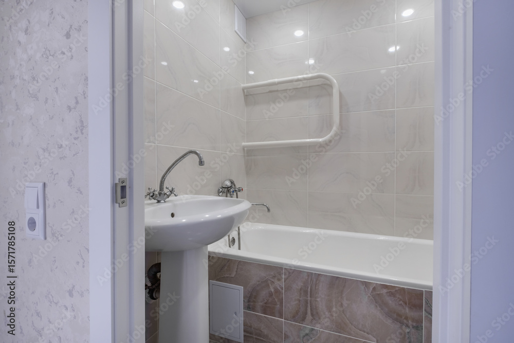 Obraz premium Water tap sink with faucet in expensive loft bathroom