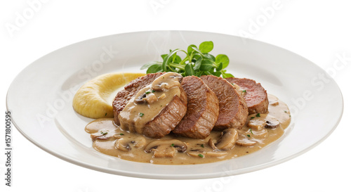 Pork medallions with mushrooms and creamy sauce on white plate  