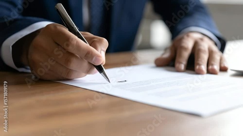 Person signing important document