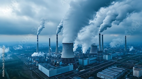 Industrial Landscape Featuring a Thermal Power Plant with Large Smokestacks Releasing Pollutants, Symbolizing Environmental Degradation and Global Warming
