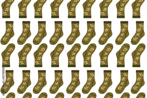 Seamless pattern featuring green socks with decorative botanical elements. Natural and earthy theme for autumn wear.