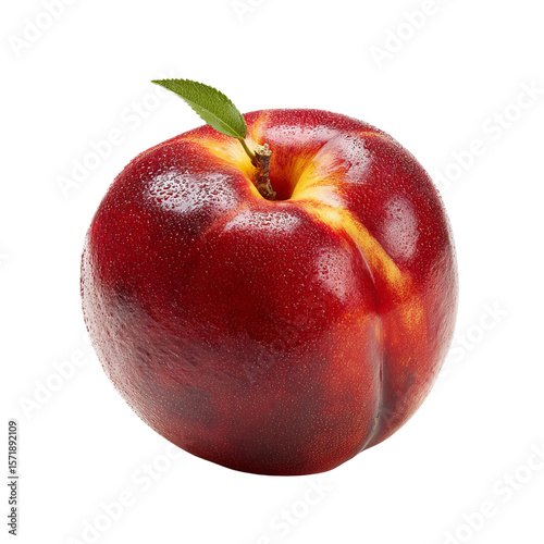 A ripe nectarine with a fresh green leaf, a symbol of fresh fruit and healthy eating. This delicious fruit is perfect for healthy diet.