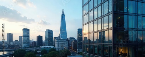 Modern London office block, sleek glass facade reflecting city skyline, architectural detail, urban landscape , cityscape, building, district
