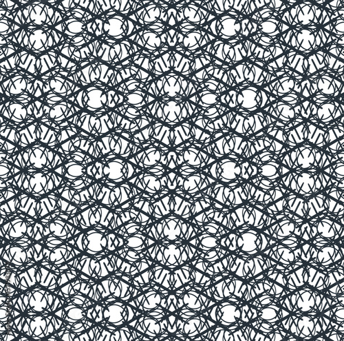 The symmetrical mass consists of intersecting lines with circles.
