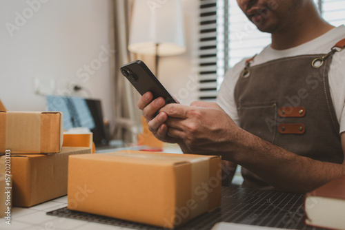 a packer is working in a room at a shipping company, an entrepreneur is a small business owner selling small items online, a businessman is working in his shipping company, parcel, product