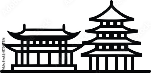 Photo of two traditional chinese buildings stand side by side in silhouette