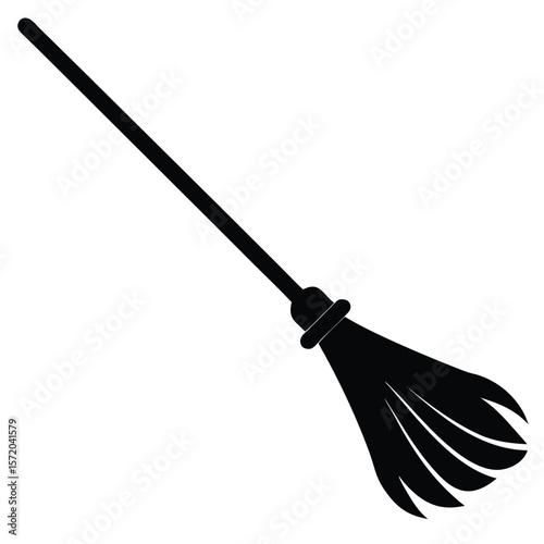 Silhouette of a black witches broom leans to the side, shown on transparent backdrop