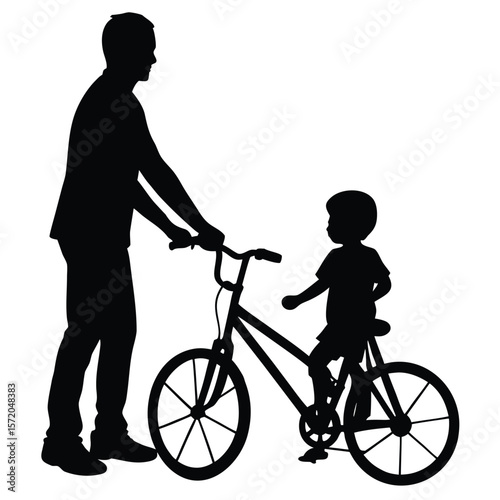 Father teaches his child how to ride a bicycle, they are both silhouetted