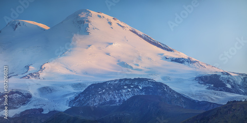 Morning light on the peaks of Mount Elbrus, sunrise in the Caucasus mountains, travel and climbing