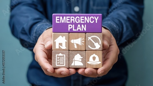 Man holds wooden blocks showing emergency plan concept