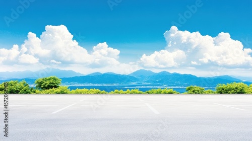Empty parking lot with scenic mountains sky. Open nature landscape outdoors. Clouds, sunlight, blue sky, greenery, calm environment, peaceful day, clean background, panoramic view, tranquility,