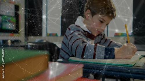 Focus shifting from book stack to student writing in notebook for education, digital overlay fading