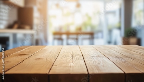Empty wooden table in modern kitchen, blurred background