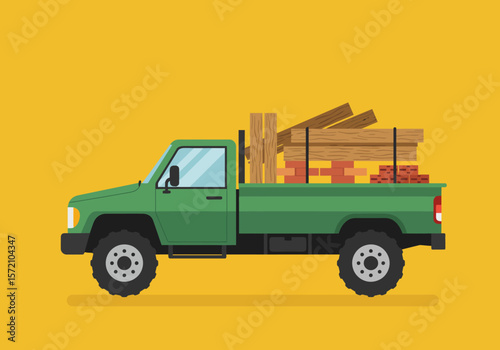 Green Pickup Truck Loaded with Lumber and Bricks.