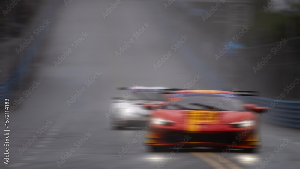 Obraz premium Motion blur race car racing on speed track, Motion blurred super car race on street track circuit, Automobile automotive transportation vehicle background.