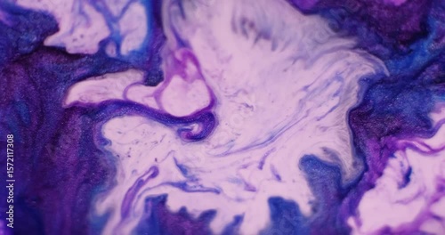 Shimmer fluid. Ink particles. Defocused purple blue colorful water glitter wet acrylic stains spreading on abstract art background.