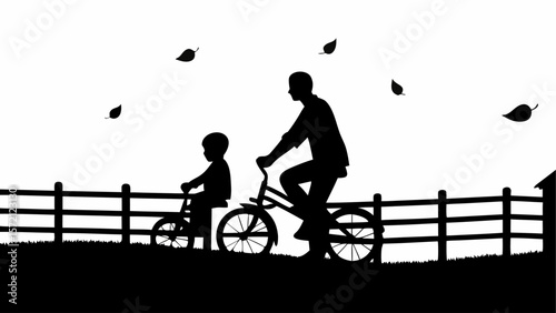 Silhouette of father and son riding bicycles in a rural setting with falling leaves and a wooden fence line