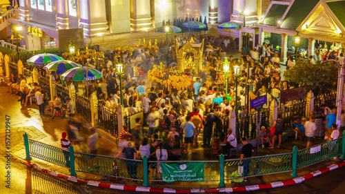 Timelapse of Erawan Temple Phra Phrom at Ratchaprasong Intersection is popular with tourists from all over the world for seeking fortune at night.