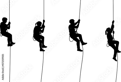 Silhouette of people rappelling down ropes outdoor adventure extreme sport climbing activity safety gear