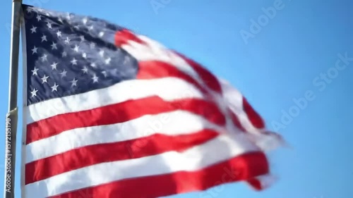 Flag Waving Gently in the Breeze Against Bright Blue Sky