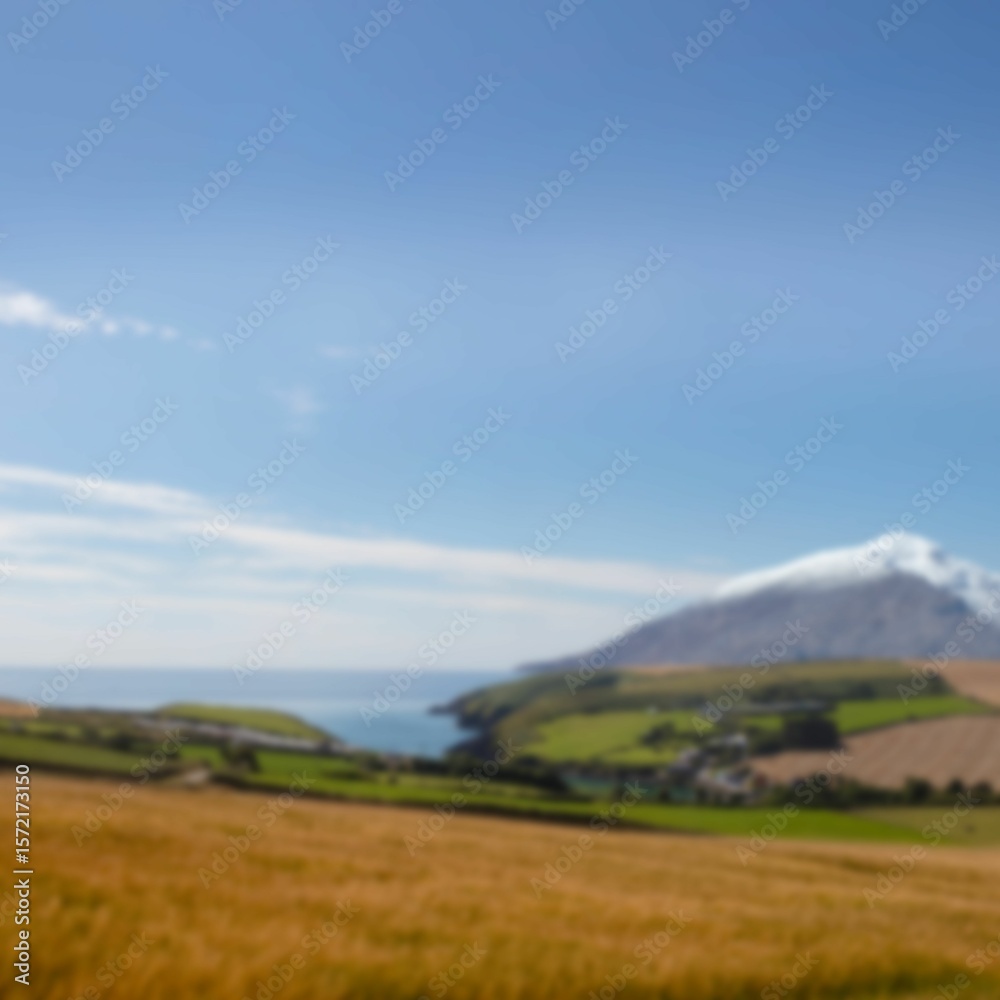 Naklejka premium Field and mountain against sky