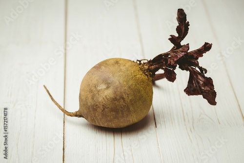 Raw beetroot on wooden table