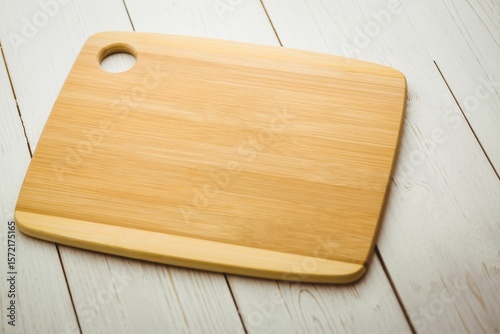 Chopping board on white wooden flooring