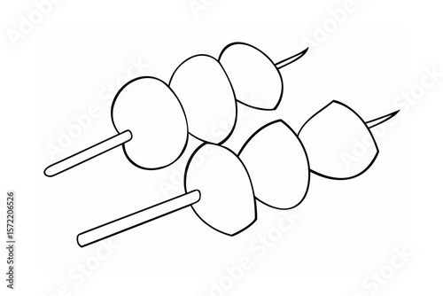 Skewered round and pointed food items skewers food on sticks