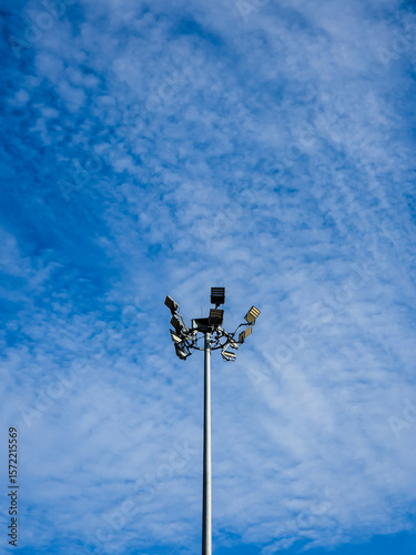 Spotlight of stadium on blue sky.