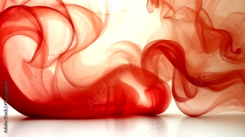 Abstract red ink drops flowing and swirling in water, artistic fluid motion