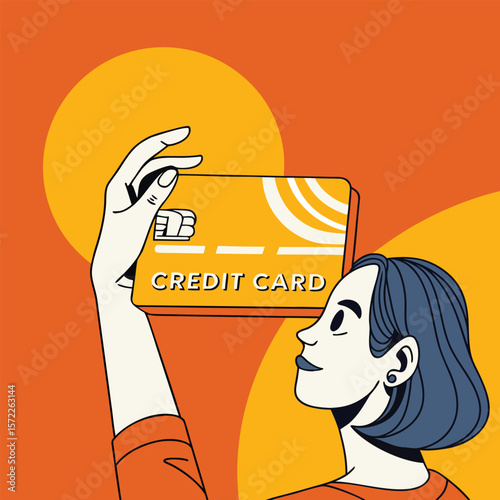 Woman holding a gold credit card with orange background