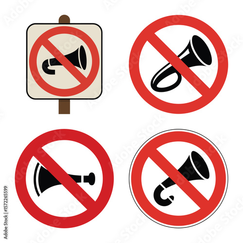 Set of four no honking signs with different horn illustrations and a signpost