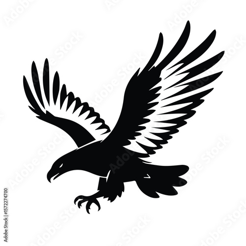 Black and white silhouette of a soaring eagle in flight. Powerful airborne predator in a bold, graphic style. Wildlife graphic design element for diverse uses -